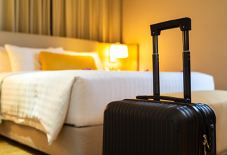Suitcase delivered standing in hotel room. concept of Hotel service and travel